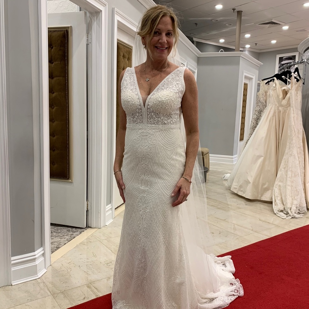 Never worn before Rosa Clara gown.  Beautiful details